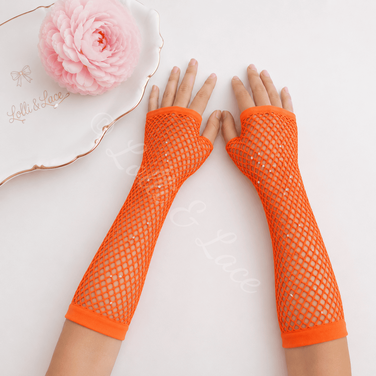 Bright orange rhinestone fishnet fingerless gloves for girls with sparkling crystal accents, perfect for Halloween costumes, dance recitals, cosplay, parties, and dress-up.