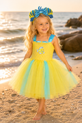 Flounder-inspired yellow and aqua tutu dress for girls with stretchy yellow bodice, layered tulle skirt, fish applique, and matching fish ear headband.