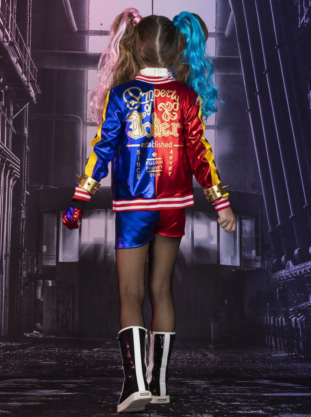 Girl's Harley Quinn costume set featuring red and blue jacket, matching shorts, two-tone wig, bat accessory, fishnet tights, and complete cosplay accessories.