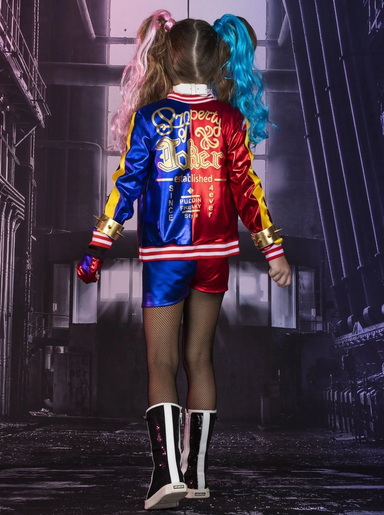 Girl's Harley Quinn costume set featuring red and blue jacket, matching shorts, two-tone wig, bat accessory, fishnet tights, and complete cosplay accessories.