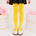 Neon yellow rhinestone fishnet tights for girls featuring sparkling crystal accents, perfect for costumes, dance recitals, birthday parties, and boutique dress-up outfits.