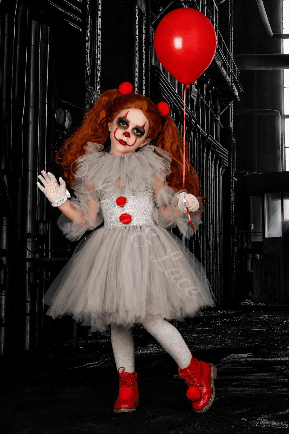 Pennywise's Twisted Carnival Tutu Dress & Accessory Set for girls featuring white tutu dress with red pom pom details, gloves, tights, red balloon and spooky clown costume accessories