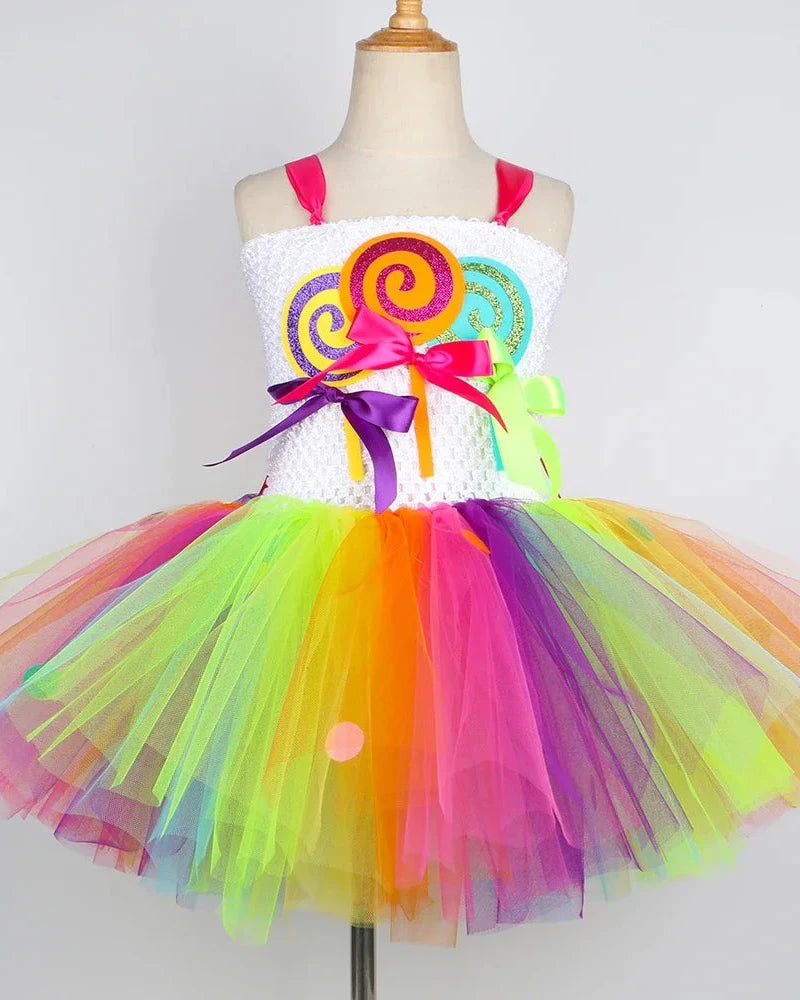 Colorful Carnival Candy Cutie tutu dress with rainbow tulle skirt, lollipop headband, and matching wand for girls Halloween costume and dress-up play.