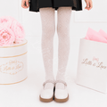 White rhinestone fishnet tights for girls with sparkling crystal accents, perfect for princess dresses, flower girl outfits, dance recitals, weddings, Halloween costumes, and dress-up.