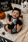 Little Bones black skeleton Halloween romper for baby with white bone print, ruffle straps and black tulle skirt