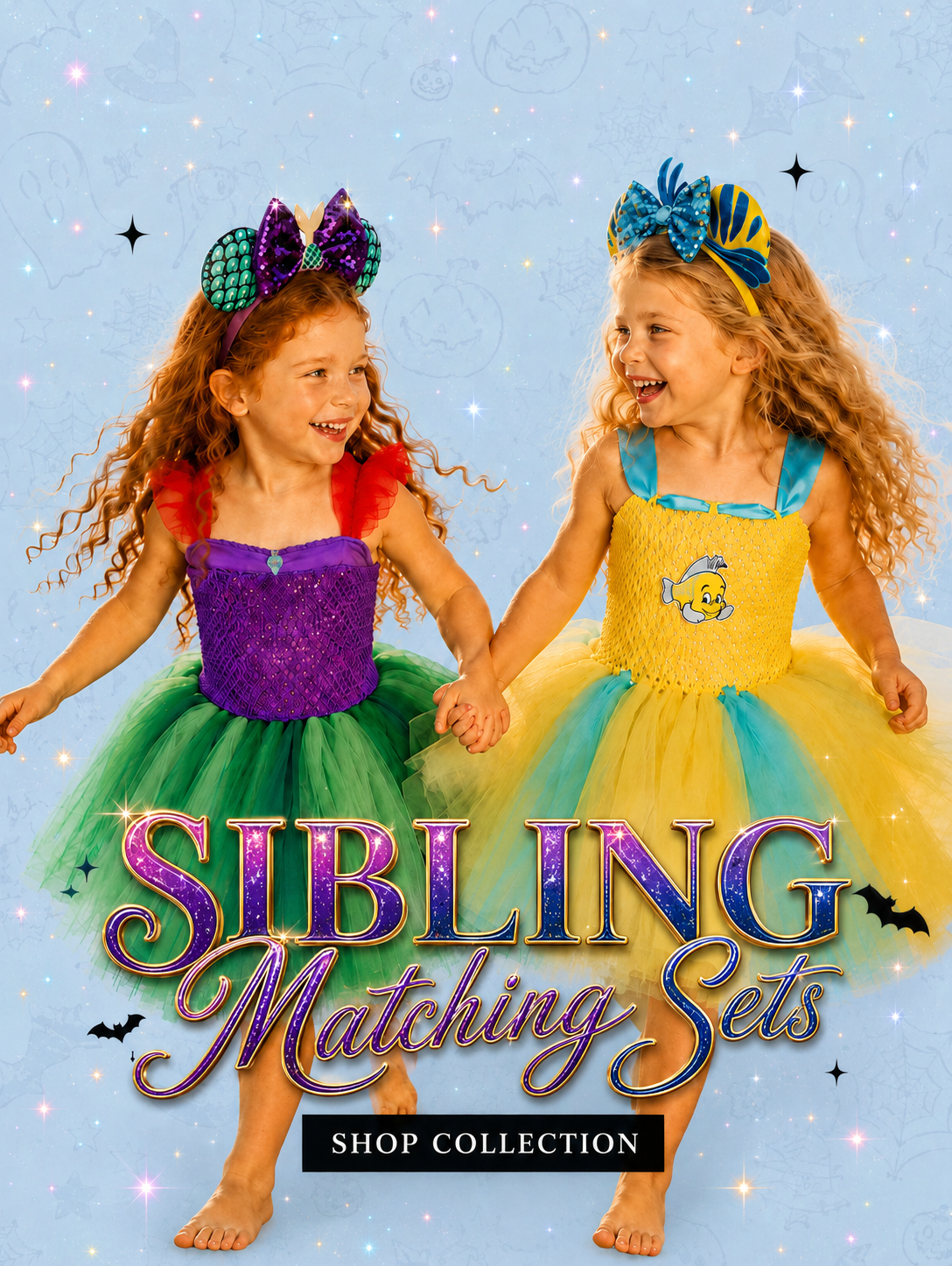 Two young girls holding hands and smiling, wearing matching colorful costume sets against a light blue sparkly background. The girl on the left wears a purple and green costume with a purple bow headband, and the girl on the right wears a yellow and blue costume with a blue and yellow bow headband.